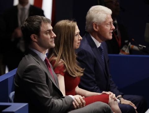 Bill Clinton, right, sits with his daughter, Chelsea, and Chelsea's husband, Marc Mezvinsky.