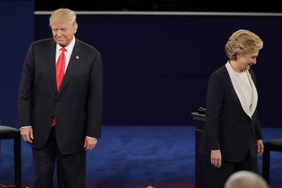 The two candidates walk to their positions at the start of the debate.