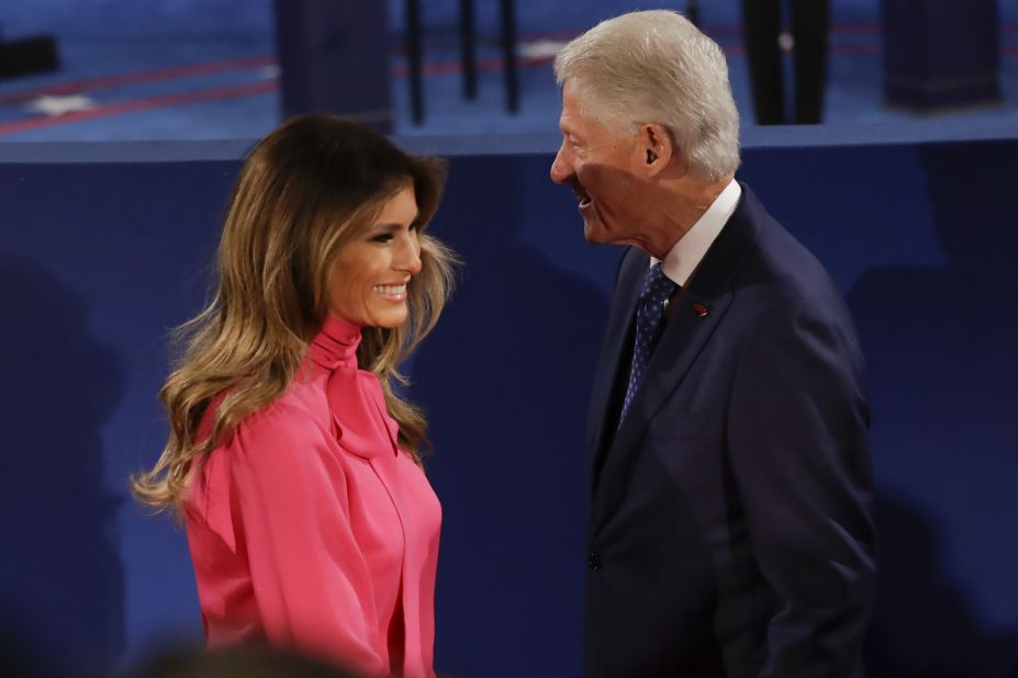 Melania Trump passes Bill Clinton after their handshake.