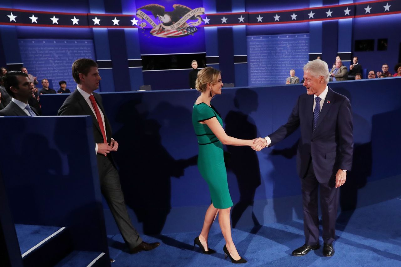 Clinton's husband, former U.S. President Bill Clinton, shakes hands with Ivanka Trump before the debate.