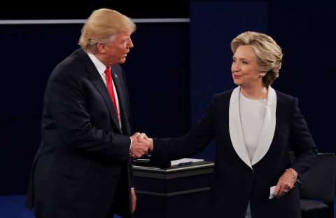 The two candidates shake hands at the end of the debate. They did not shake at the beginning.