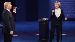 Democratic presidential nominee former Secretary of State Hillary Clinton and Republican presidential nominee Donald Trump speak during the town hall debate at Washington University on October 9, 2016, in St. Louis.