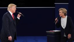 Democratic presidential nominee former Secretary of State Hillary Clinton and Republican presidential nominee Donald Trump speak during the town hall debate at Washington University on October 9, 2016, in St. Louis.