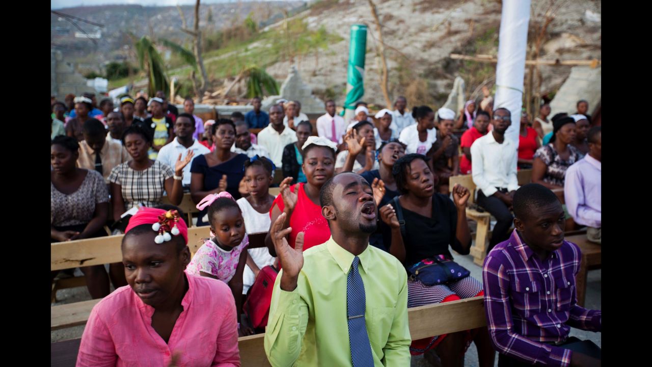 Worshippers pray at a Jeremie church destroyed by Matthew on October 9.