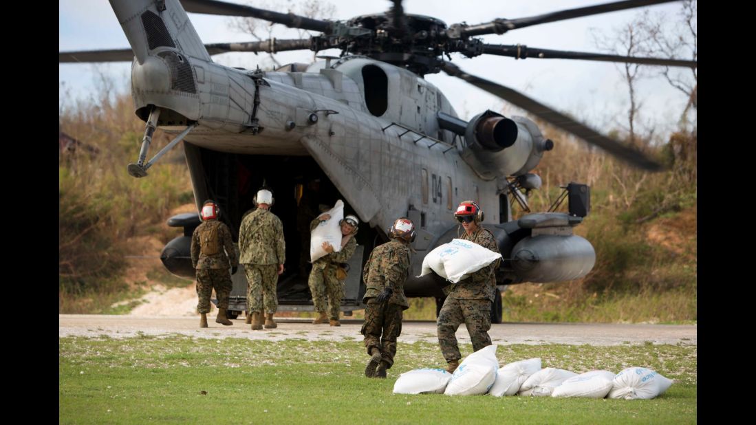 US soldiers unload bags of food from a helicopter in the hard-hit coastal city of Jeremie on October 9.