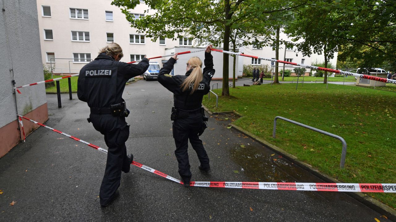 Police secure a residential area in Chemnitz, Germany, after explosives were found in an apartment.