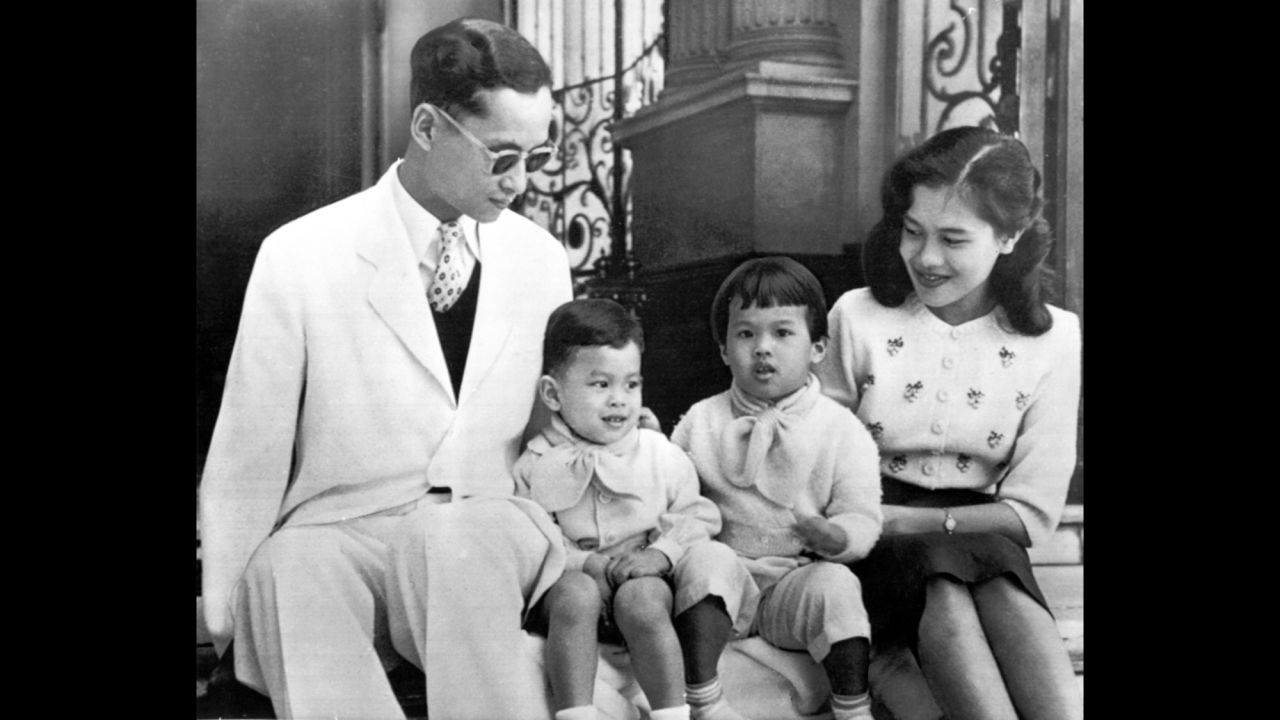 The King and Queen pose with their children, Crown Prince Vajiralongkorn and Princess Ubol Ratana, on the steps of Bangkok's Chitralada Palace in 1955. Two more daughters, Princesses Maha Chakri Sirindhorn and Chulabhorn Walailak, were born in 1955 and 1957.