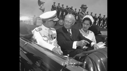 The royal couple ride with U.S. President Dwight Eisenhower during a five-day state visit to the United States in 1960.