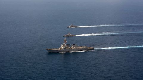 The USS Mason conducts formation exercises with Navy patrol crafts in September. 
