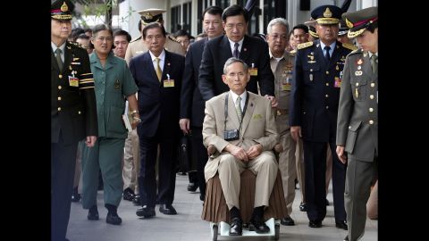 The King is wheeled towards his yacht in 2010, during a rare public appearance to open a new flood gate and two bridges in Bangkok.