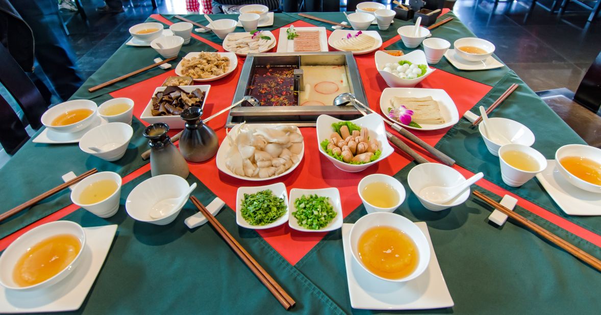 <strong>Numbing-and-hot hotpot: </strong>Many restaurants offer divided hotpots, so diners can cook their food in either a seething cauldron of chilies or a mildly flavored broth.