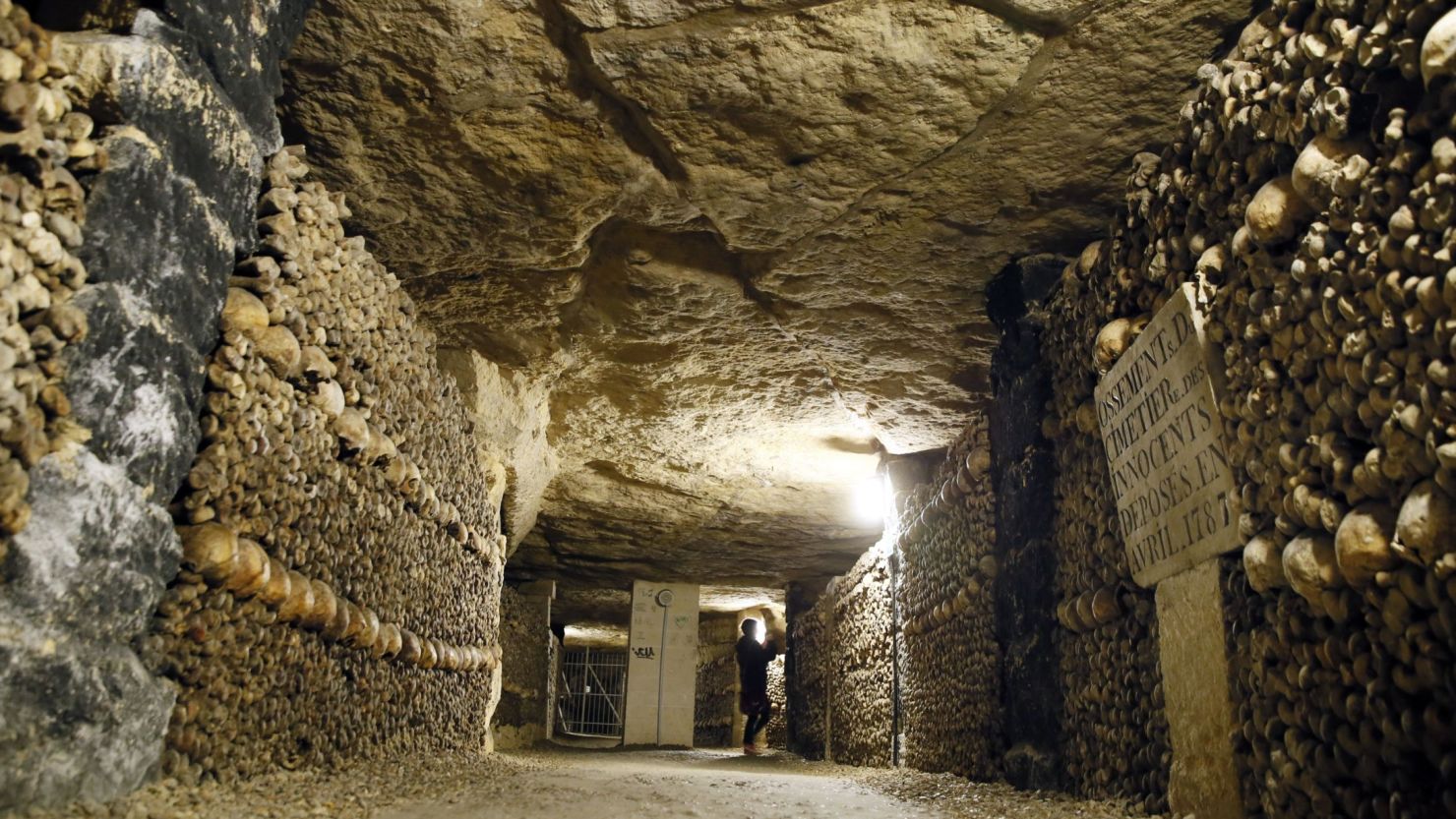 A woman visits the Paris catacombs in October 2014. 