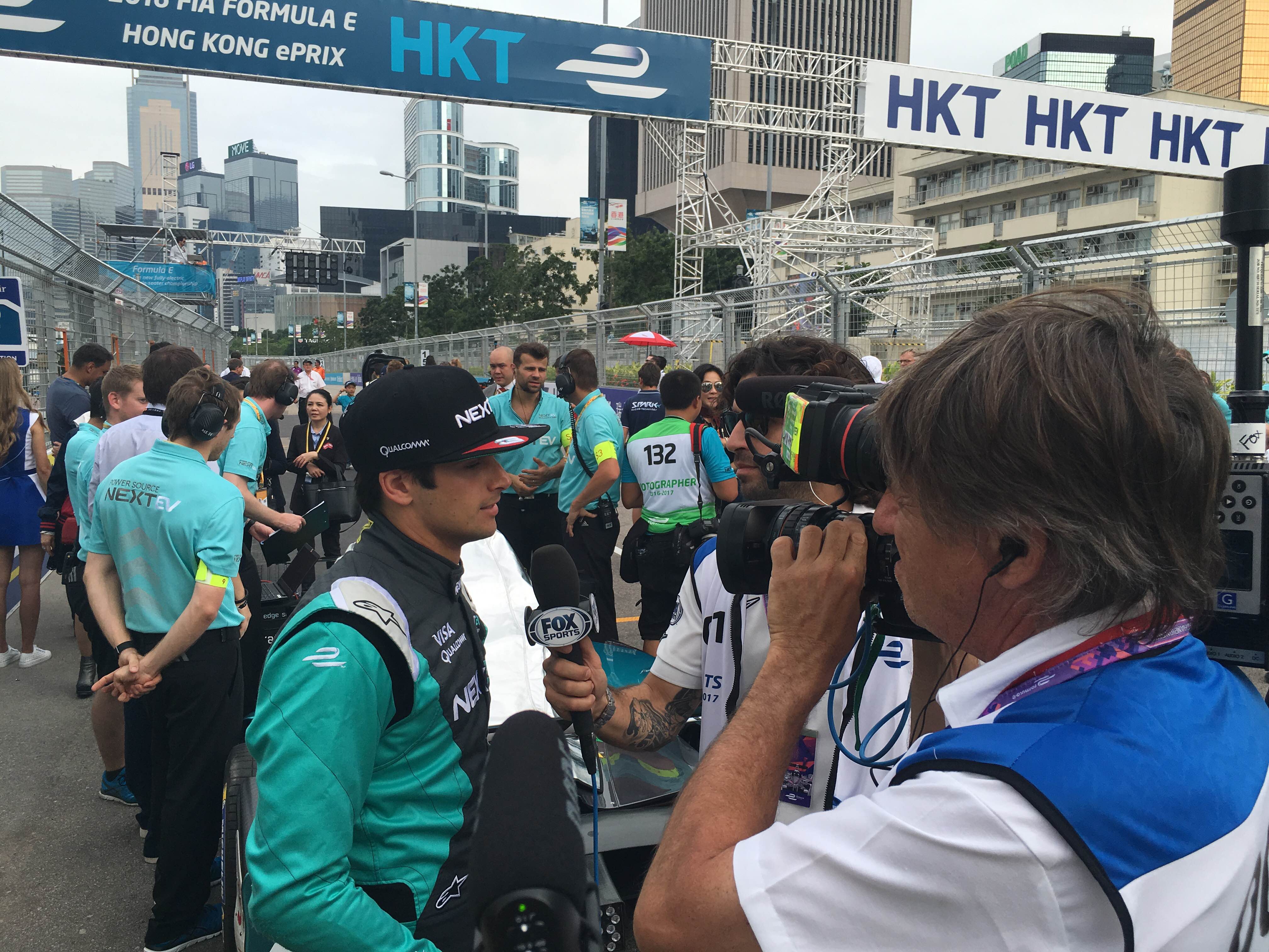 Polesitter Nelson Piquet Jr talking to the media on the grid ahead of Sunday's race.