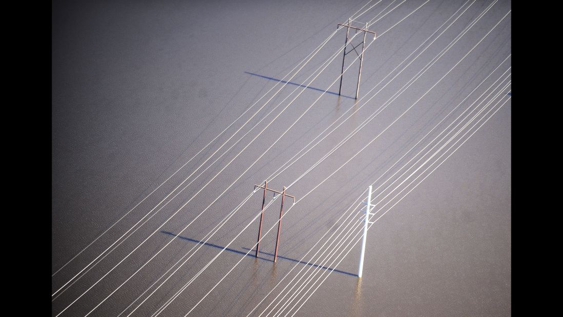 Floodwaters surround power lines near Nichols on October 10.