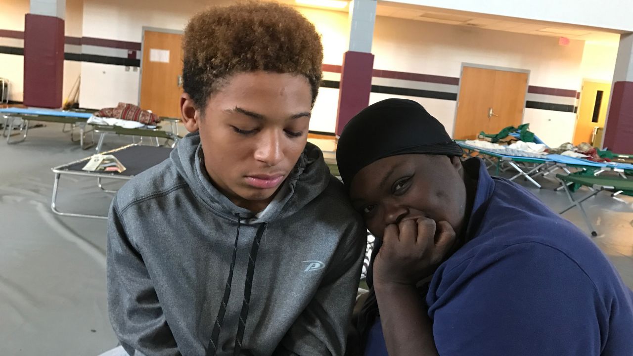 Toshica Medley and her 14-year-old son Javares Dawes have been at the Nash Central High School shelter since Sunday after their apartment complex was flooded to the roof. 