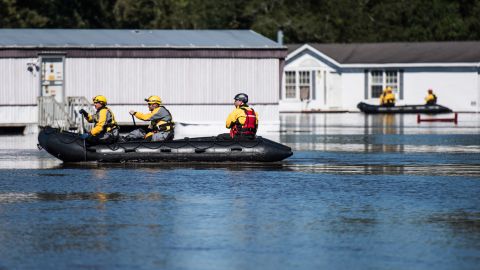 Rescue teams maneuver through floodwaters in Lumberton, North Carolina, on October 10. President Barack Obama has declared a major disaster in North Carolina and ordered federal aid to supplement state, tribal and local recovery efforts.