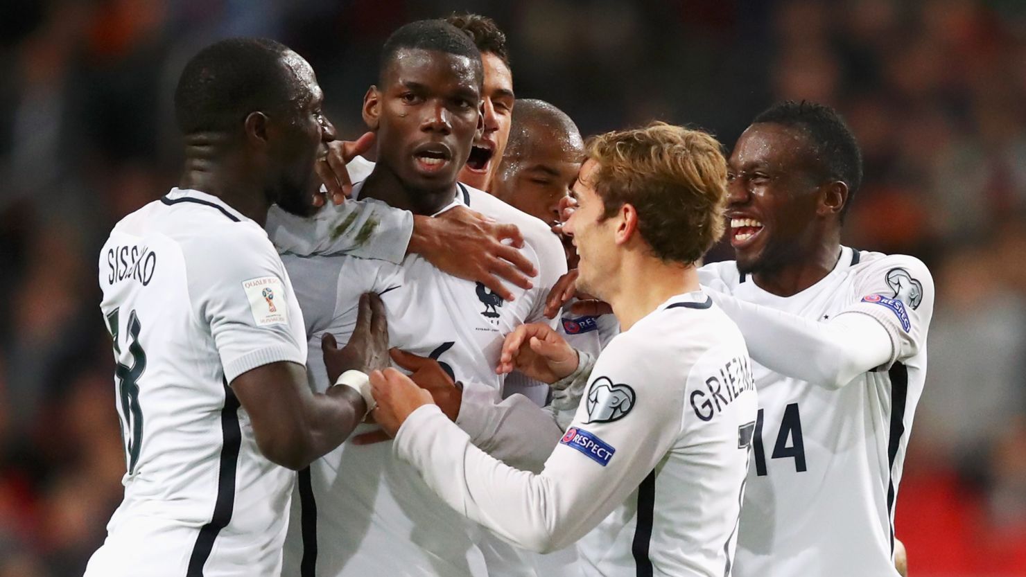 Paul Pogba is mobbed by his teammates after scoring France's winning goal.