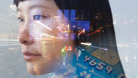 composite image of woman's face and night view of Hong Kong