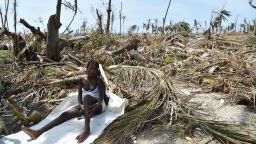 TOPSHOT - A woman sits next to her destroyed house in Les Cayes, Haiti on October 10, 2016, following the passage of Hurricane Matthew. 
Haiti faces a humanitarian crisis that requires a "massive response" from the international community, the United Nations chief said , with at least 1.4 million people needing emergency aid following last week's battering by Hurricane Matthew. / AFP / HECTOR RETAMAL        (Photo credit should read HECTOR RETAMAL/AFP/Getty Images)