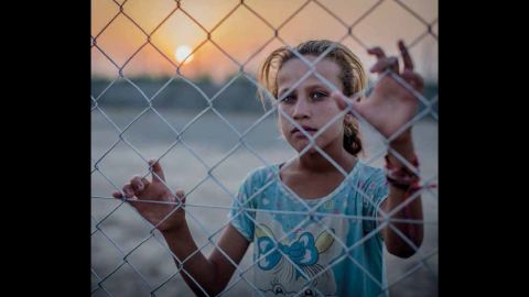 Fighting in Iraq forced Saja, 11, and her family to flee. They now live in a  camp for displaced people. 