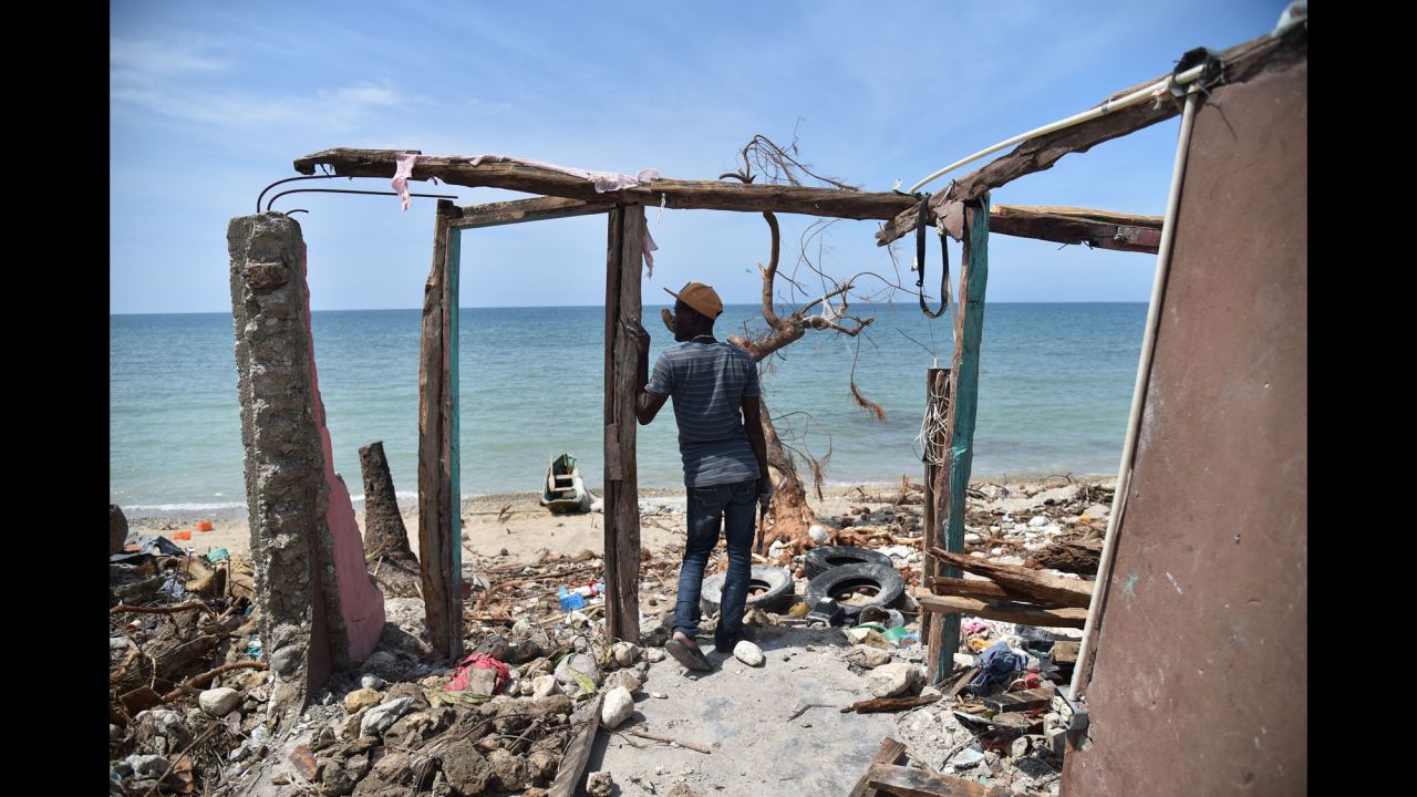 A man stands in the remnants of a house destroyed by Hurricane Matthew in the southern town of Les Cayes on Monday, October 10. Matthew wreaked havoc in Haiti, killing hundreds, destroying homes and knocking out electricity in the impoverished Caribbean nation. More than 1.4 million people are in need of urgent assistance, a UN official says.