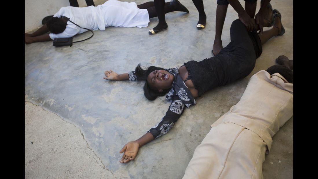 Family members react during the funeral of Roberto Laguerre, 32, on Saturday, October 8, in Jeremie. Laguerre was killed when the hurricane struck.