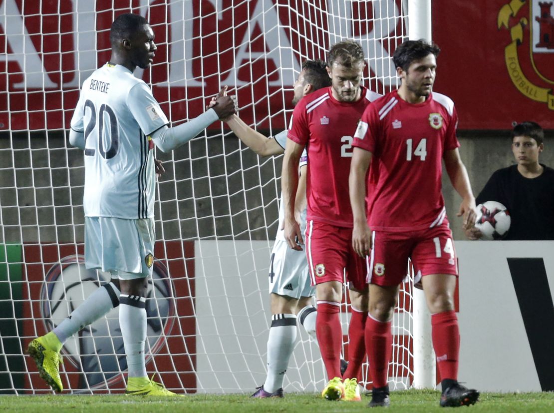 Benteke celebrates with teammate Dries Mertens at the Faro Municipal Stadium