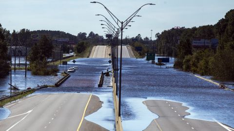 The Lumber River flows over Interstate 95 on Monday in Lumberton, North Carolina.