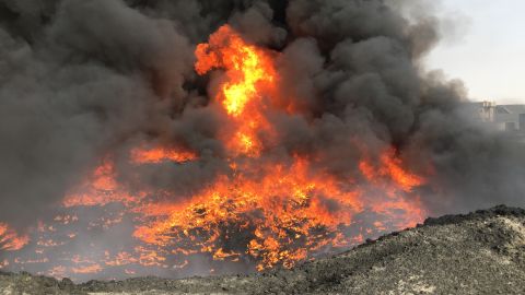 ISIS has been pushed out, but it left behind burning oil wells.