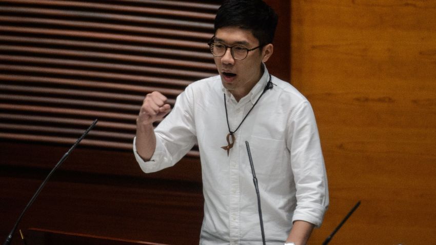 Newly elected lawmaker Nathan Law, 23, gestures after taking the Legislative Council Oath at the first meeting of the Sixth Legislative Council (Legco) in Hong Kong on October 12, 2016.
Hong Kong rebel lawmakers shouted, banged drums and railed against "tyranny" on October 12 when they took their oaths of office in the city's parliament, as calls grow for a split from Beijing. / AFP / ANTHONY WALLACE        (Photo credit should read ANTHONY WALLACE/AFP/Getty Images)