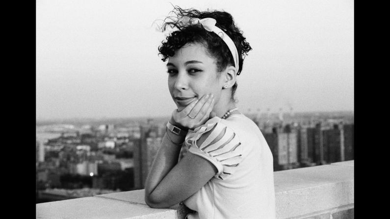 Chiquita, one of Conzo's closest friends, poses atop the roof where he lived. "She made all of her clothes," he said, "so that's one of her tops that she cut up and made herself."