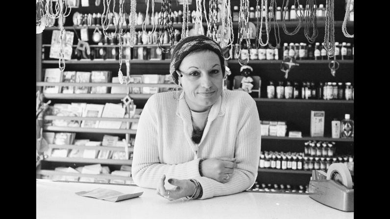 A clerk at a botanica, a store that sells religious artifacts, in 1981. "People used to walk in and buy crosses, beads, lotions, potions, this that and the other," Conzo said. "They're not as common as they were when I was growing up, but you can still find them."