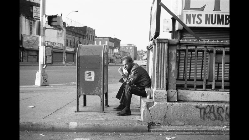 A man sits on a stoop at Third Avenue and 149th Street.