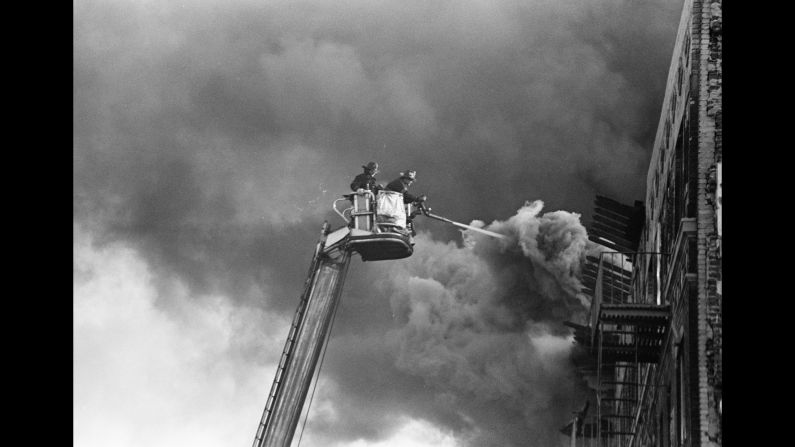 A fire burns in the Bronx in 1980. "I grew up in a time period where the Bronx was burning, so to speak," Conzo said. "It's so funny how a lot of my images are of firefighters putting out fires in my neighborhood, and I end up working for the fire department 30 years later."