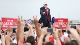 Republican presidential nominee Donald Trump acknowledges supporters at the conclusion of his campaign rally on the tarmac of Lakeland Linder Regional Airport in Lakeland, Florida on October 12, 2016. / AFP / Gregg Newton        (Photo credit should read GREGG NEWTON/AFP/Getty Images)