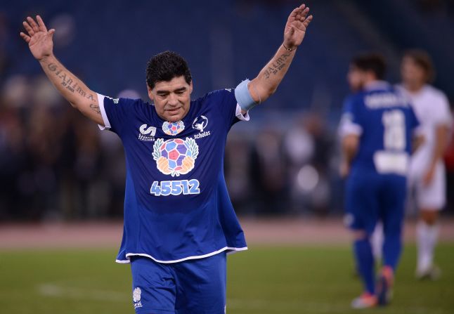 Maradona salutes the crowd as he leaves the pitch.