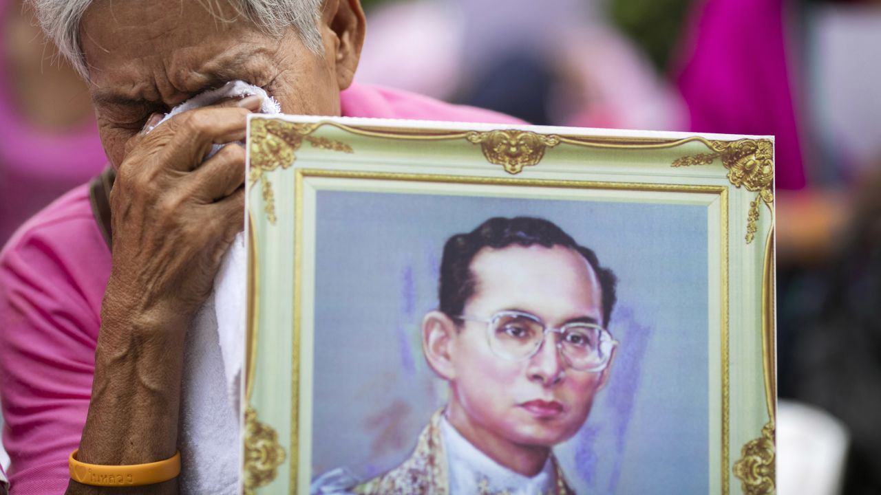 A woman prays for Thailand's King Bhumibol Adulyadej at Siriraj Hospital where the king was being treated in Bangkok, Thailand.
