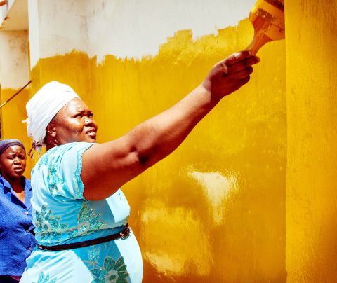 Bishop Rose Mungafu jumped at the chance to paint her church yellow. "For me, yellow is the color of the sun and the sun shines above everybody," she said.