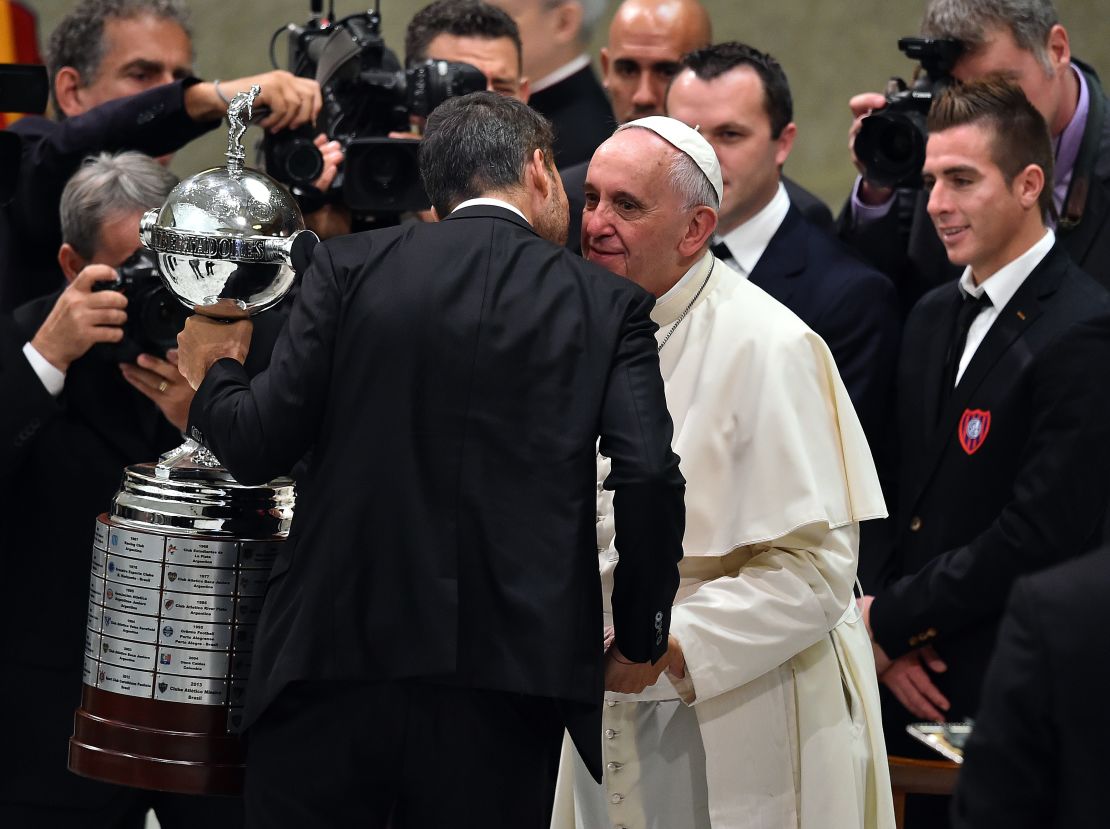 Pope Francis welcomes players of San Lorenzo to the vatican following their Copa Libertadores win.