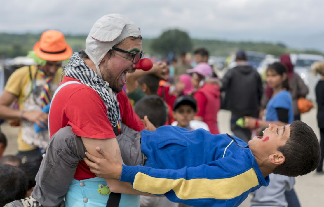 A group of clowns entertain children at a camp for migrants and refugees at the Greek-Macedonian border.
