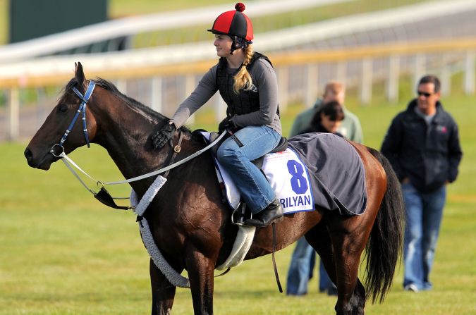 Moore is no stranger to the highest level of the sport, here riding out Mourilyan in preparation for the 2009 Melbourne Cup. She was a strapper for the horse -- trained by her father -- which placed third.