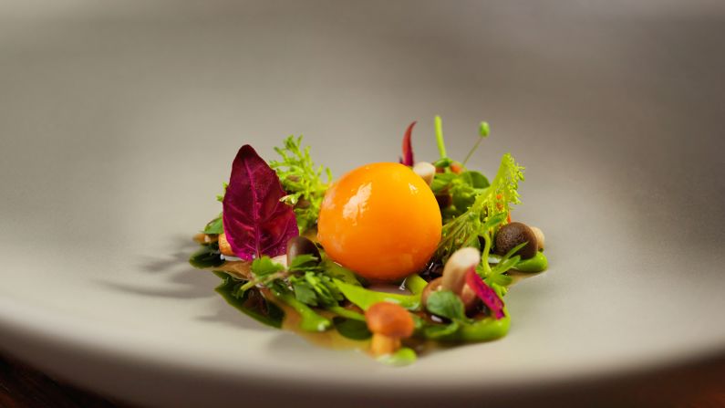 At ECCO, chef Rolf Fliegauf's creations include a simple but stellar starter of organic egg yolk with onions and wild herbs. The dish uses eggs from a neighbor just 200 meters from the restaurant, while the herbs come from their own meadow behind the hotel.
