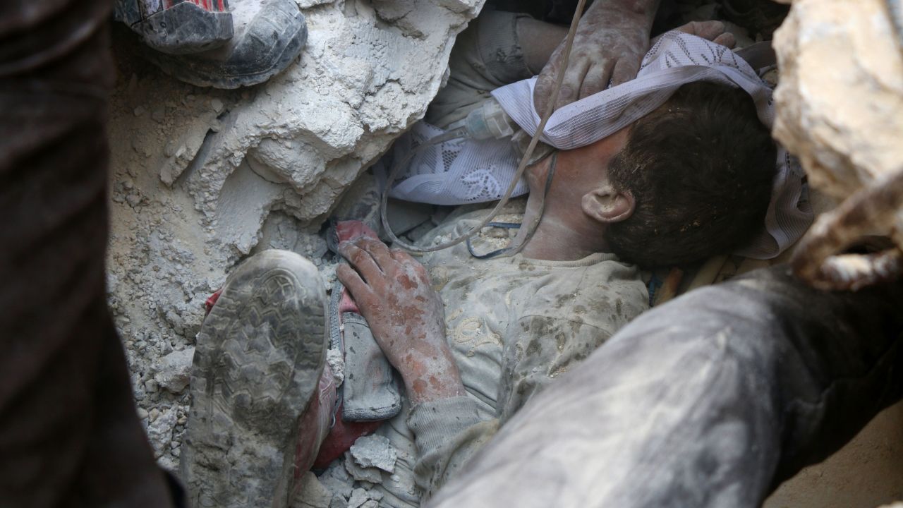 Jameel Mustafa Habboush, 13, receives oxygen as he is pulled from rubble after Russian airstrikes on eastern Aleppo.