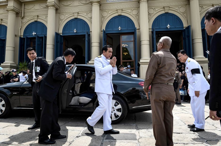 The Prime Minister arrives to pay respects to the late King at the Grand Palace on October 14.