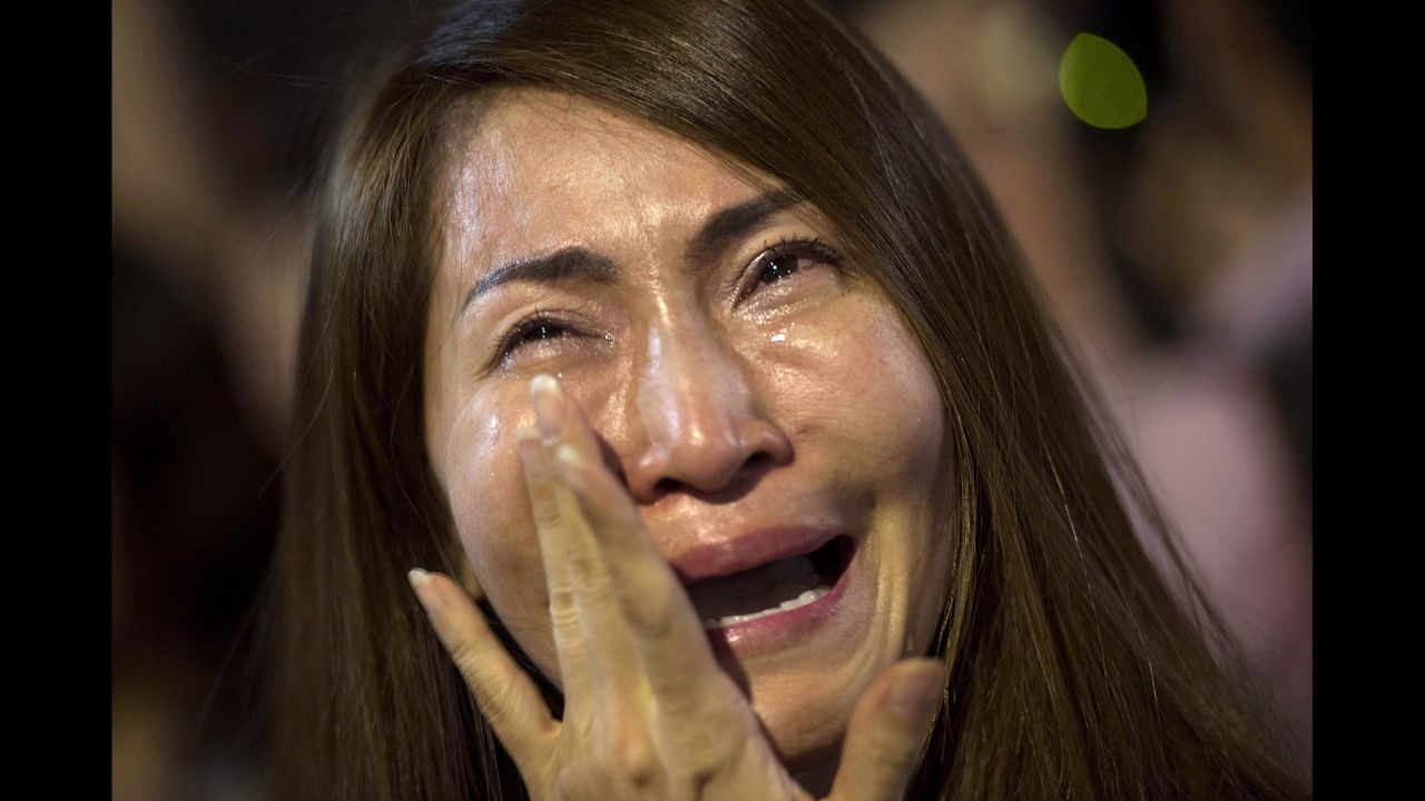 A women cries after learning of the King's death on October 13 in Bangkok.