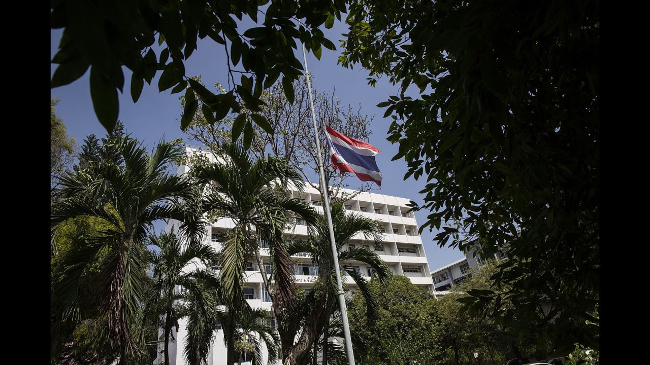 A flag flies at half-staff outside a government hospital on October 14 in Chiang Mai, Thailand. According to a palace statement, all government buildings will fly the Thai flag at half-staff for 30 days starting on Friday.