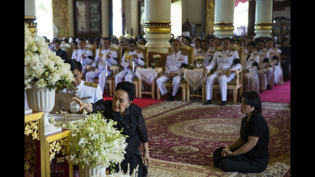 Dignitaries participate in a ceremony commemorating the King at Wat Phra Singh on Friday in Chiang Mai.