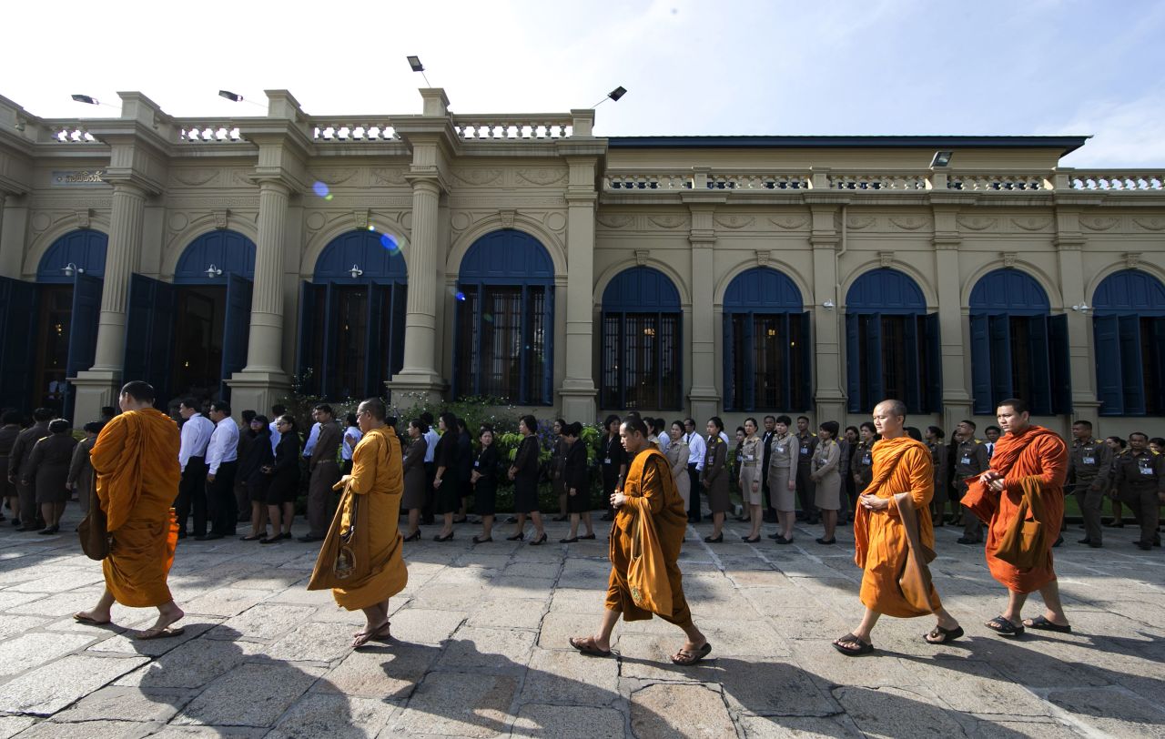 Buddhist monks line up to offer condolences at the Grand Palace in Bangkok on Friday.