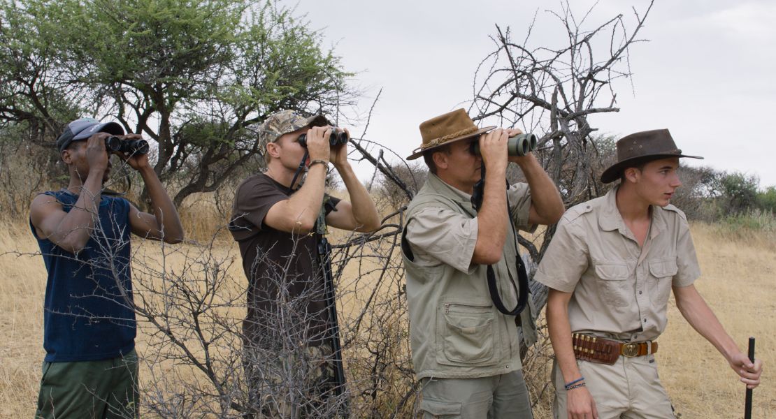 An Austrian father and son (right) stalk their prey in the Namibian bush.