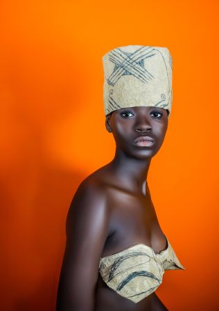A young woman wears handmade clothes woven from raw materials using traditional basket weaving techniques. The images by Keyezua question how developed Angolan design is today? It's about "inviting the viewers to think further than African prints as identity" writes Keyezua, as these "are often produced in Europe by European designers and sold to Africans."